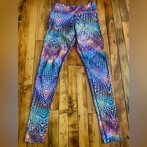 Multicolored kaleidoscopic print leggings by Kos USA.